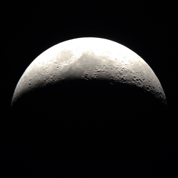 A crescent Moon shot by Miller using her XT8 Dobsonian and iPhone 5