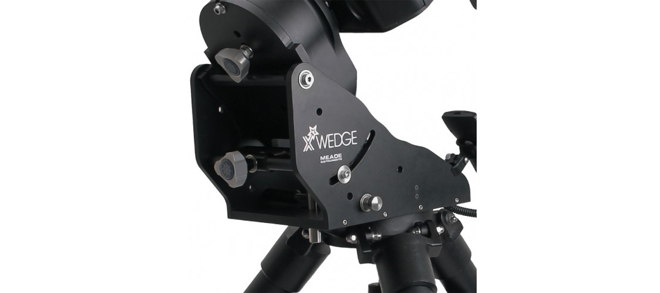 The optional Meade X-Wedge installed between the drive base and the tripod